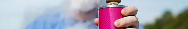 Person using VYRO-One Carbon Pink Hookah outdoors